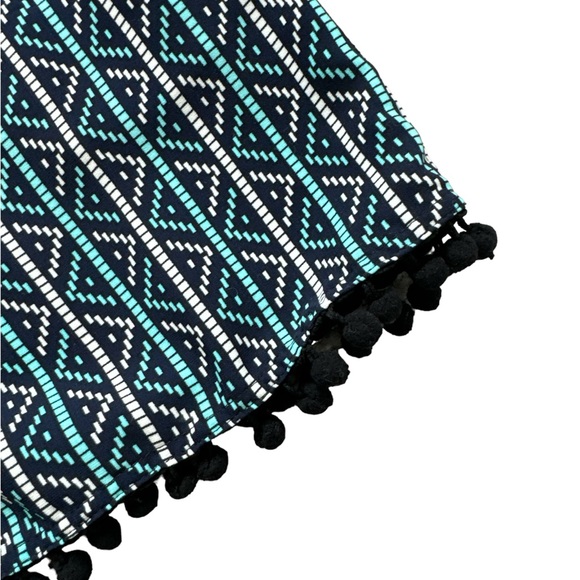 Strapless multi-color romper with ruffle bust line and pompom fringe on shorts. - Picture 3 of 3